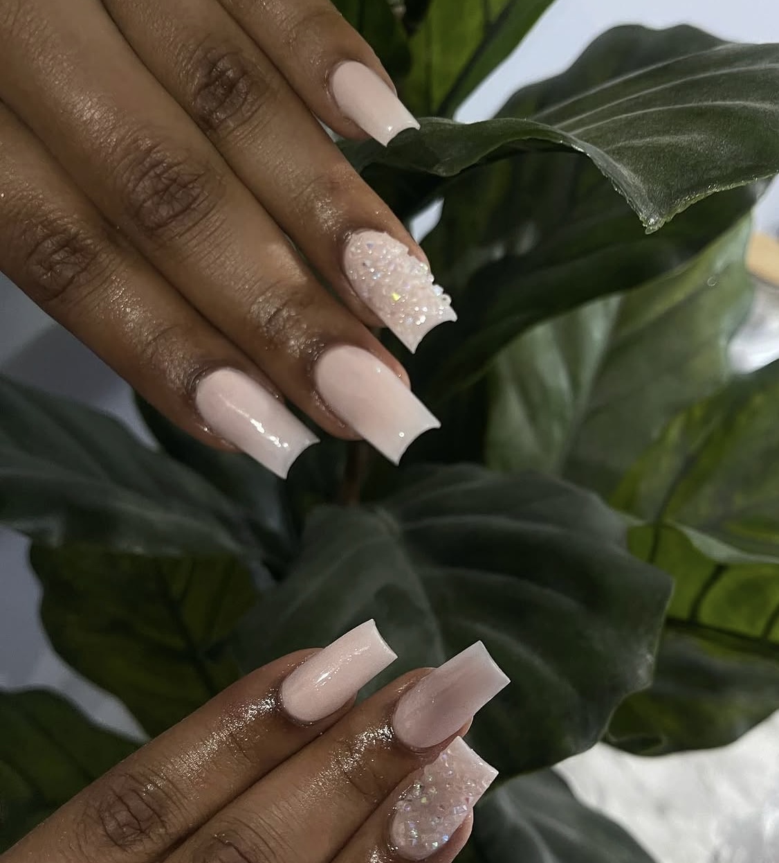 Soft blush sculpted nails with a glitter accent nail