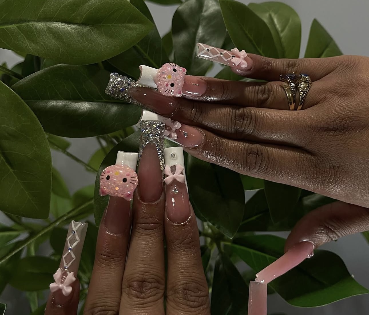 Pink sculpted nail set with bows and charms
